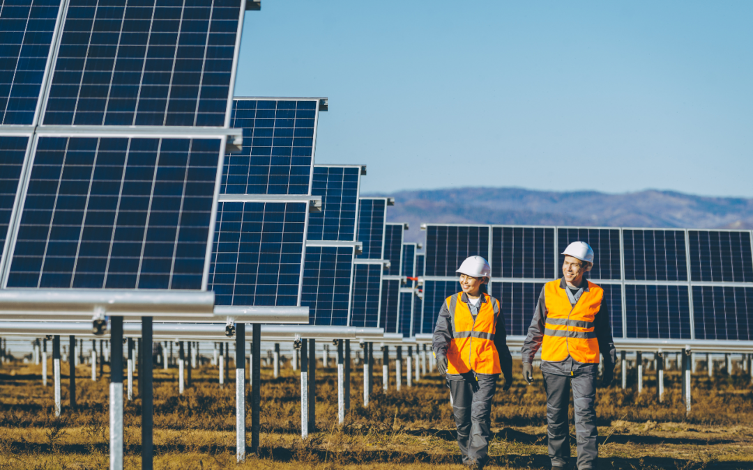 two commercial solar power installers in orange county inspecting solar panels