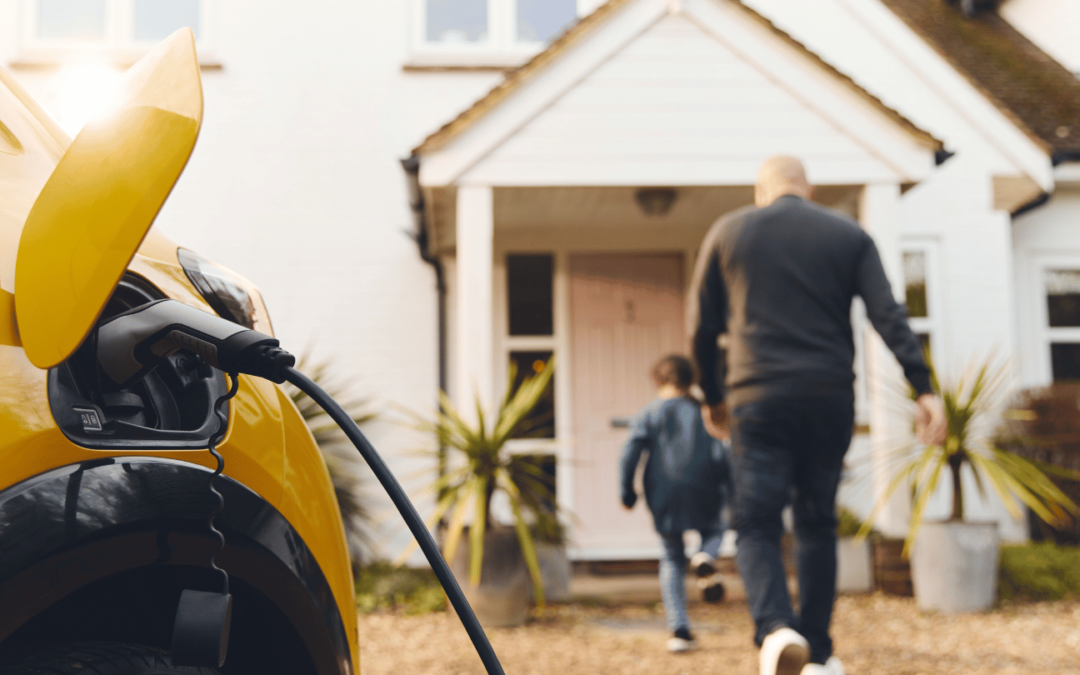 family walking away from car with v2g technology charging in orange county