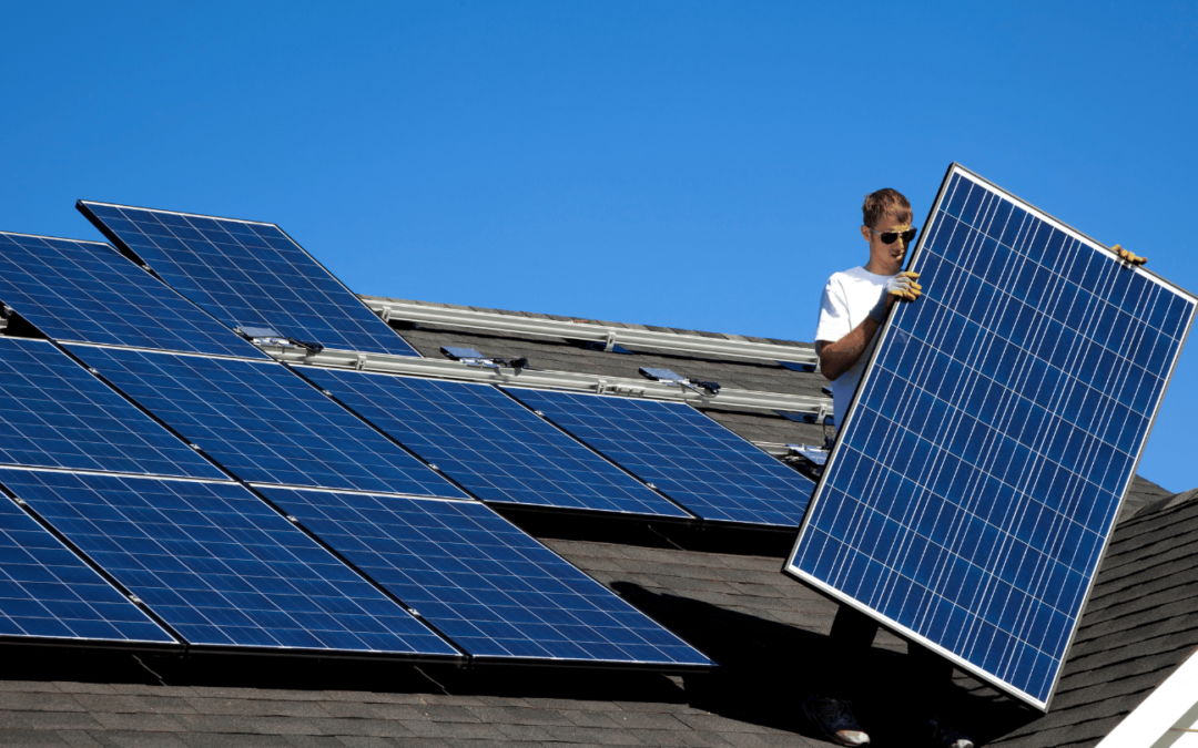 orange county solar panel installer placing solar panel on roof