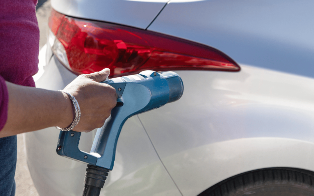 person using irvine ev charging station