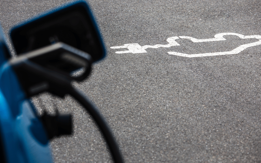 closeup of ev charging in orange county parking lot