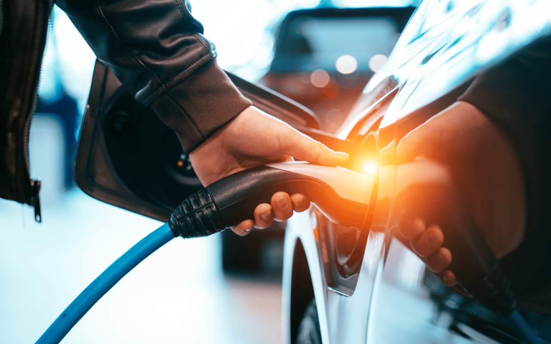 person charging ev using mpge in orange county