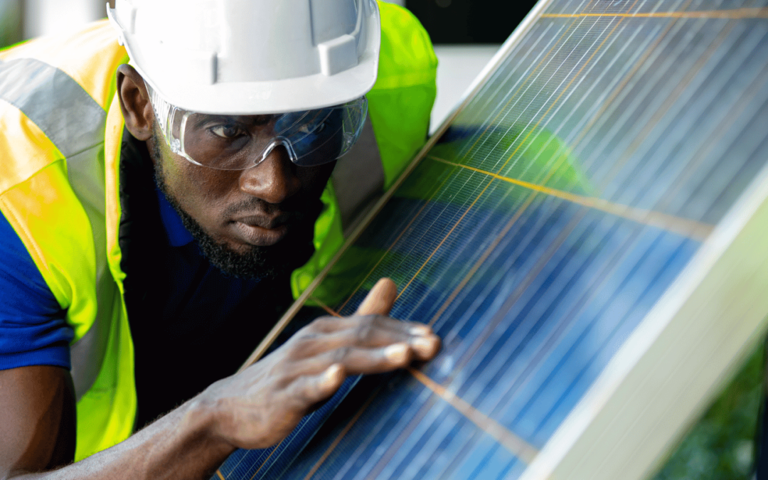 anaheim solar installer examining solar panels for longevity